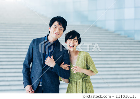 Portrait of a couple walking arm in arm 111016113