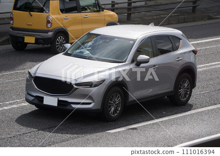 SUV utility vehicle road driving SUV utility vehicle road driving 111016394