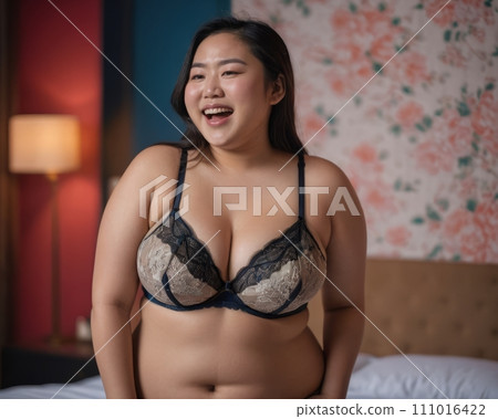 an asian woman wearing a black and gold bra an asian woman wearing a black and gold bra 111016422