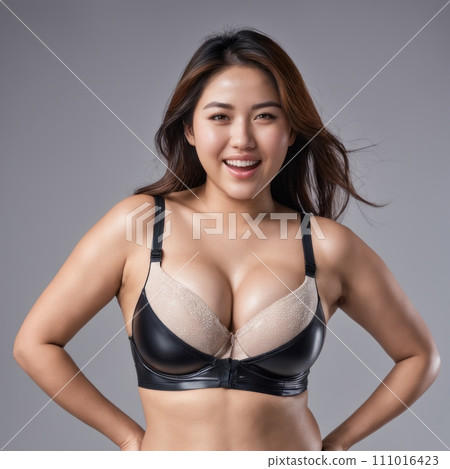 an asian woman wearing a black and tan bra 111016423
