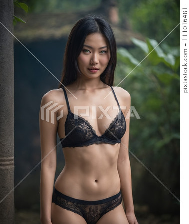 an asian woman in black lingerie posing for the camera an asian woman in black lingerie posing for the camera 111016481