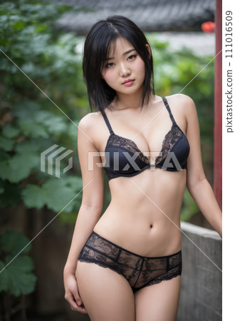 an asian woman in black lingerie posing for the camera 111016509