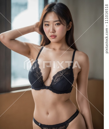 an asian woman in black lingerie posing in front of a window 111016518