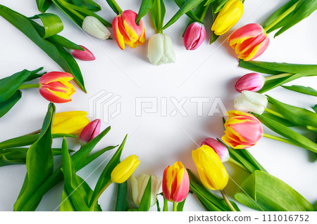 Heart from tulips on white background. Valentine's day, place for text. Heart from tulips on white background. Valentine's day, place for text. 111016752