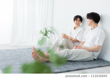 A couple relaxing in relaxing wear 111016945