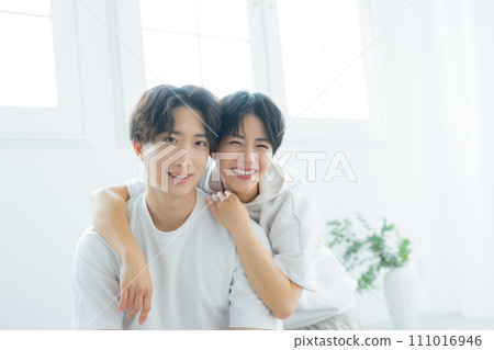 A couple relaxing in relaxing wear 111016946