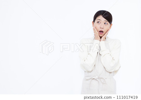 A surprised housewife in her 40s A surprised housewife in her 40s 111017419