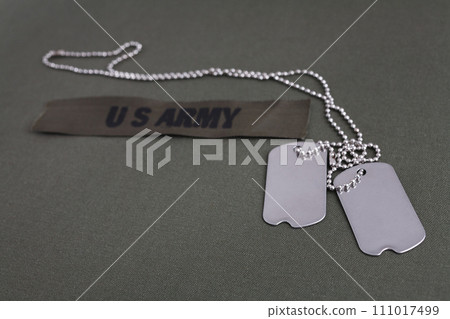 U.S. Army Branch Tape with dog tags on olive drab uniform 111017499