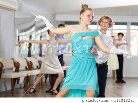 Boy and girl dancing ballroom dance in studio 111018253