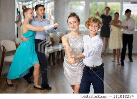 Boy and girl dancing waltz in studio Boy and girl dancing waltz in studio 111018254
