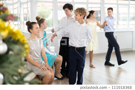 Boy invites girl to dance waltz 111018368