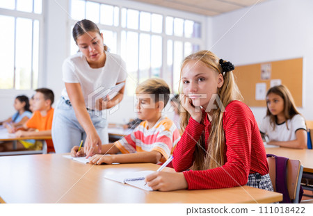 Portrait of girl in classroom Portrait of girl in classroom 111018422