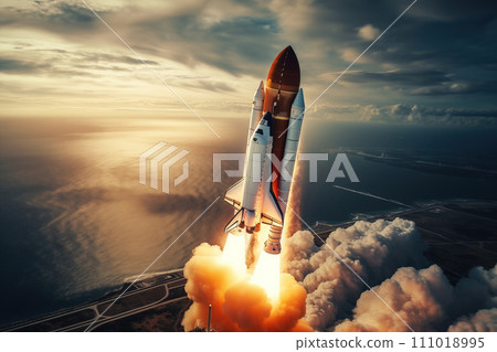 Aerial view of rocket launch at sunrise over ocean coast 111018995