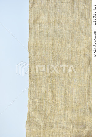 torn sackcloth isolated on white background, burlap fabric texture for design torn sackcloth isolated on white background, burlap fabric texture for design 111019415