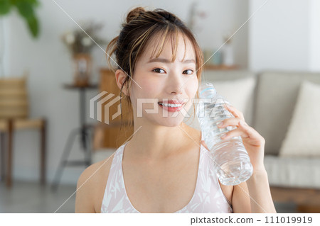 Fitness yoga woman drinking water Fitness yoga woman drinking water 111019919