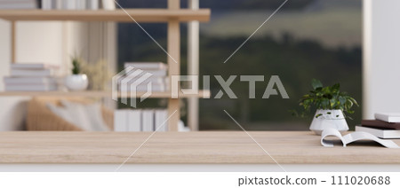 Minimal wooden table with a copy space with a blurred background of a modern, minimalist living room Minimal wooden table with a copy space with a blurred background of a modern, minimalist living room 111020688