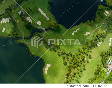 Aerial view of beautiful green golf field fairway and putting green,Top view image for sport background and travel nature background, Amazing green nature view 111021850