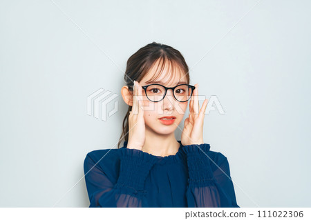 A smiling woman wearing glasses A smiling woman wearing glasses 111022306