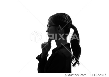 Silhouette of a thinking woman's profile Silhouette of a thinking woman's profile 111022314