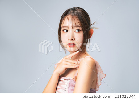 Fashion portrait of a woman with stylish hair and makeup Fashion portrait of a woman with stylish hair and makeup 111022344