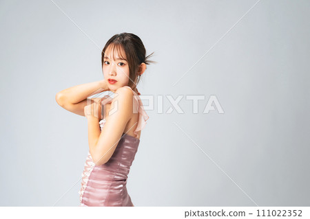 Fashion portrait of a woman with stylish hair and makeup Fashion portrait of a woman with stylish hair and makeup 111022352