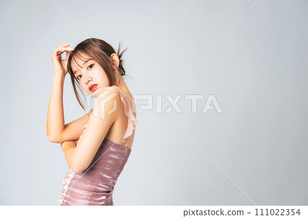 Fashion portrait of a woman with stylish hair and makeup Fashion portrait of a woman with stylish hair and makeup 111022354