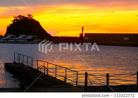 A beautiful sunset over the coast of Nishina Port 111022772