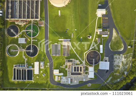 Aerial view of modern water cleaning facility at urban wastewater treatment plant. Purification process of removing undesirable chemicals, suspended solids and gases from contaminated liquid 111023061