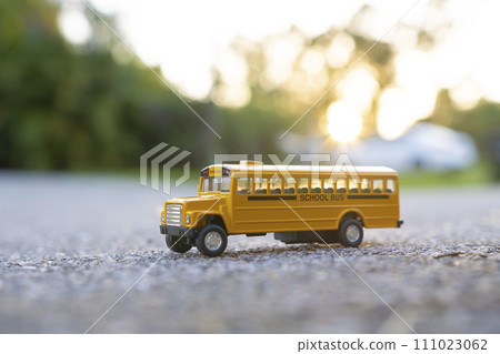 Small model of american yellow school bus as symbol of education in the USA Small model of american yellow school bus as symbol of education in the USA 111023062