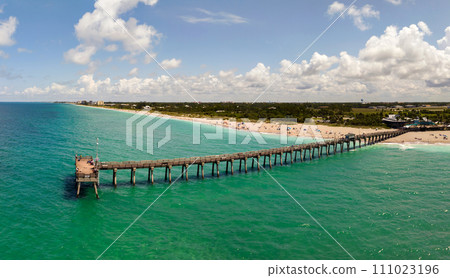 Bright ocean landscape at Venice fishing pier in Florida, USA. Popular vacation place in south Bright ocean landscape at Venice fishing pier in Florida, USA. Popular vacation place in south 111023196