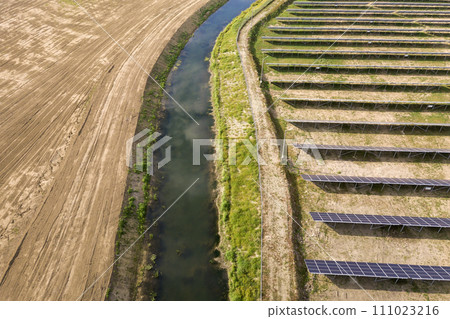 Aerial view of solar power plant. Electric panels for producing clean ecologic energy. Aerial view of solar power plant. Electric panels for producing clean ecologic energy. 111023216