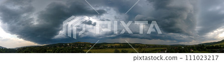 Landscape of dark clouds forming on stormy sky during thunderstorm over rural area. Landscape of dark clouds forming on stormy sky during thunderstorm over rural area. 111023217