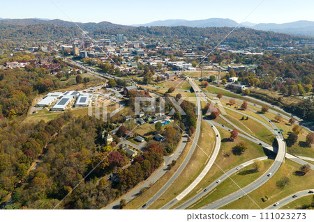 American freeway intersection in Asheville, North Carolina with fast driving cars and trucks in autumnal season. View from above of USA transportation infrastructure 111023273