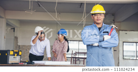Banner Group of engineer team brainstorming at construction building with manager, contractor, worker meeting together at constrcution site. Team engineer look at Blueprint teamwork with copy space 111024234