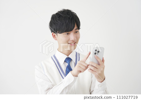 High school boy using a smartphone, white background 111027719