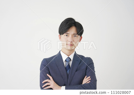 Angry young businessman white background 111028007