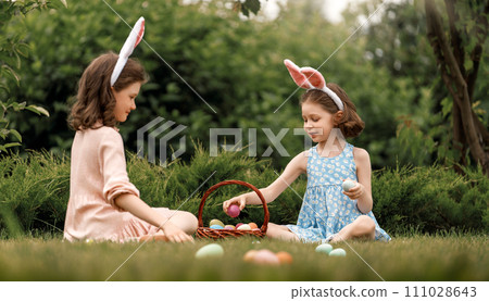 children with painting eggs outdoors children with painting eggs outdoors 111028643