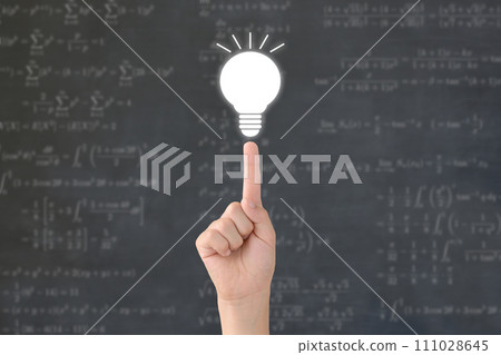 A child's hand and a miniature light bulb - an image of a child's inspiration 111028645