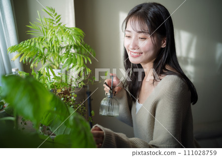 Women watering plants 111028759
