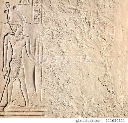 Horizontal background with ancient Egyptian bas-relief - figure of the pharaoh  on stone wall, Egypt, Africa. Backdrop with sandstone carving with hieroglyph. Mock up template. Copy space for text 111030111