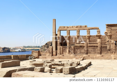 Temple of Isis on Agilkia Island (Philae) and Nile river, reservoir of Aswan Low Dam, Egypt. Summer vacation, relaxing on cruise ships Temple of Isis on Agilkia Island (Philae) and Nile river, reservoir of Aswan Low Dam, Egypt. Summer vacation, relaxing on cruise ships 111030117