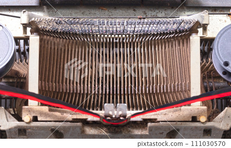 Broken metal typewriter, vintage object Broken metal typewriter, vintage object 111030570