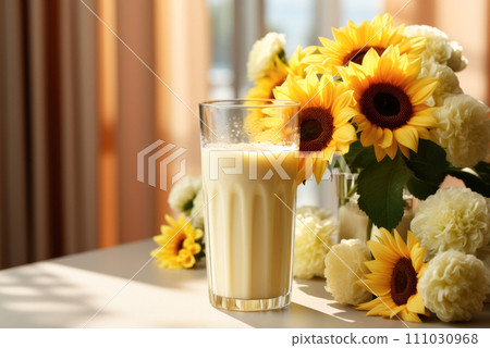 Alternative milk from sunflower seeds in a glass on the table 111030968