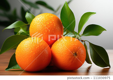 Tangerines or clementines with green leaves on a wooden table 111030975