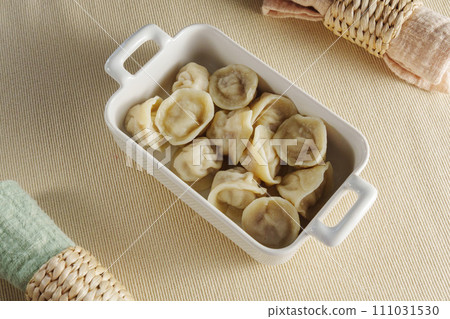 Homestyle Dumpling Delight in a Cozy Kitchen Setting Homestyle Dumpling Delight in a Cozy Kitchen Setting 111031530