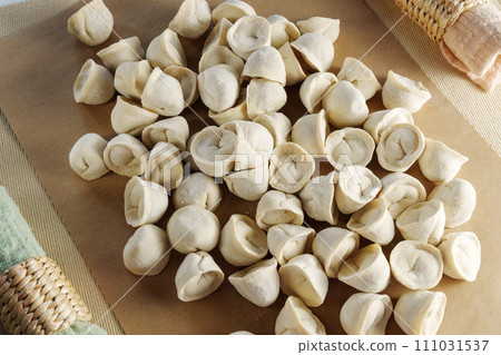 Artisanal Dumplings and Ravioli Crafted by Hand, selective focus Artisanal Dumplings and Ravioli Crafted by Hand, selective focus 111031537