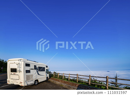 Camper car standing at Lake Mashu Observation Deck on a clear day Camper car standing at Lake Mashu Observation Deck on a clear day 111031597