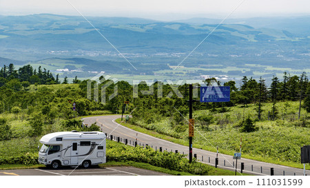 Camper car standing at Lake Mashu Observation Deck on a clear day Camper car standing at Lake Mashu Observation Deck on a clear day 111031599