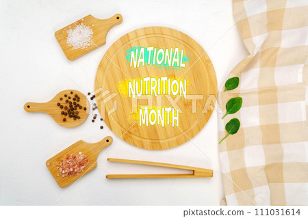 A creatively arranged display featuring text announcing National Nutrition Month by natural food elements. A creatively arranged display featuring text announcing National Nutrition Month by natural food elements. 111031614