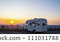 A camper van with the setting sun in the background from Lake Mashu Observation Deck 111031788